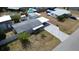 Aerial view shows a well-maintained house, large driveway, and surrounding landscape at 4125 Worcester Rd, Sarasota, FL 34231