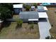 An aerial view of the house shows the large driveway and surrounding area at 4125 Worcester Rd, Sarasota, FL 34231