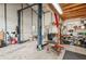 Large metal garage building with car lift, work benches, and ample lighting at 4125 Worcester Rd, Sarasota, FL 34231
