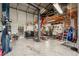 This is the inside of a large gray metal building with a lift and other tools at 4125 Worcester Rd, Sarasota, FL 34231