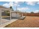 Exterior shot of detached garage; includes outdoor shed, metal roof, and backyard at 4125 Worcester Rd, Sarasota, FL 34231