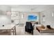 Bright living room featuring a modern kitchen, entertainment area, and neutral color palette at 4125 Worcester Rd, Sarasota, FL 34231