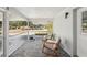 Inviting screened porch features neutral tones and outdoor view seating at 4125 Worcester Rd, Sarasota, FL 34231