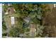 A property line and aerial view of a home and its surrounding area including trees at 6175 Beechwood Dr, Dade City, FL 33523