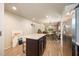 Spacious kitchen with a view into the living room with an island at 6175 Beechwood Dr, Dade City, FL 33523