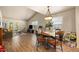 Open living room with a dining area, hardwood floors, and lots of natural light at 6175 Beechwood Dr, Dade City, FL 33523