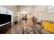 Inviting living room featuring hard wood floors with dining and kitchen in the background at 6175 Beechwood Dr, Dade City, FL 33523