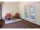 Screened-in porch with seating, table, and door to the back yard at 6175 Beechwood Dr, Dade City, FL 33523
