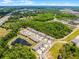 Aerial view showcases the community layout with lush greenery, ponds, and well-planned residential areas at 17677 Nectar Flume Dr, Land O Lakes, FL 34637