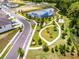 An aerial view showcases the community's pond, walking trails, park, and residential area at 17677 Nectar Flume Dr, Land O Lakes, FL 34637