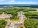 An aerial view of a new construction community with well-maintained landscaping and serene ponds at 17677 Nectar Flume Dr, Land O Lakes, FL 34637