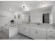 Bright bathroom with double vanity, soaking tub, and modern finishes, creating a luxurious and relaxing space at 17677 Nectar Flume Dr, Land O Lakes, FL 34637