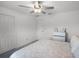 Inviting bedroom with neutral tones, ceiling fan, and closet, offering a comfortable and serene atmosphere at 17677 Nectar Flume Dr, Land O Lakes, FL 34637