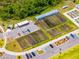 Bird's eye view of the Angeline community garden featuring plots, parking, and greenhouses at 17677 Nectar Flume Dr, Land O Lakes, FL 34637