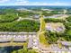 Scenic aerial shot displaying the expansive community with lush greenery, ponds, and roadways at 17677 Nectar Flume Dr, Land O Lakes, FL 34637