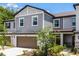 Charming two-story townhouse with a two-car garage and well-maintained landscaping at 17677 Nectar Flume Dr, Land O Lakes, FL 34637
