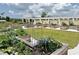 View of community garden with raised garden plots filled with plants at 17677 Nectar Flume Dr, Land O Lakes, FL 34637