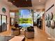 Interior view of the market with seating, view of a lake through large window, and various displays at 17677 Nectar Flume Dr, Land O Lakes, FL 34637