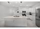 Bright, modern kitchen featuring white cabinets, stainless steel appliances, and a center island at 17677 Nectar Flume Dr, Land O Lakes, FL 34637