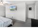 Spacious main bedroom featuring a ceiling fan, adjacent sitting area, and abundant natural light at 17677 Nectar Flume Dr, Land O Lakes, FL 34637
