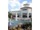 Exterior showcases retail shopping with a pond, water features, outdoor seating, and lush landscape at 17677 Nectar Flume Dr, Land O Lakes, FL 34637