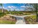 A picturesque walking path meanders through the lush, green landscape in a scenic community park at 17677 Nectar Flume Dr, Land O Lakes, FL 34637