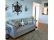 Cozy living room with a comfortable sofa, nautical decor, and plenty of natural light at 4310 Falmouth Dr # 301, Longboat Key, FL 34228