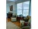 Inviting living room featuring comfortable armchairs, hardwood floors, and serene decor with large windows at 4310 Falmouth Dr # 301, Longboat Key, FL 34228