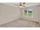 Bedroom featuring a window with blinds and a ceiling fan with lighting at 4804 Myrtle Oak Dr # 11, New Port Richey, FL 34653
