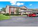 Inviting condo exterior with covered parking, manicured landscaping, and brick accents at 4804 Myrtle Oak Dr # 11, New Port Richey, FL 34653