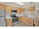 Functional kitchen with stainless steel appliances, marble countertops, and light wood cabinetry at 4804 Myrtle Oak Dr # 11, New Port Richey, FL 34653