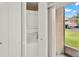 Handy laundry closet area with stacked washer and dryer unit for easy laundry days at 4804 Myrtle Oak Dr # 11, New Port Richey, FL 34653