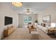 Inviting living room with plush carpet, modern furniture, and a bright window showcasing natural light at 4804 Myrtle Oak Dr # 11, New Port Richey, FL 34653