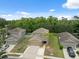 Aerial view of home showcases curb appeal and landscaping in a neighborhood setting at 12534 Chenwood Ave, Hudson, FL 34669