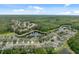 Gorgeous aerial view of a well-planned community with lush greenery and ponds at 12534 Chenwood Ave, Hudson, FL 34669