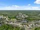 Scenic aerial view showcases the neighborhood's layout and surrounding green space at 12534 Chenwood Ave, Hudson, FL 34669