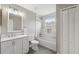 Bathroom featuring white vanity, tub with shower, tiled wall and floors, and good lighting at 12534 Chenwood Ave, Hudson, FL 34669