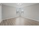 An airy bedroom featuring hard surface floors and lots of natural light at 12534 Chenwood Ave, Hudson, FL 34669