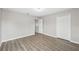 The renovated bedroom features wood look floors and a walk-in closet at 12534 Chenwood Ave, Hudson, FL 34669