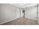 The modern bedroom has hard surface floors and a walk in closet at 12534 Chenwood Ave, Hudson, FL 34669