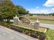 The Verandahs community sign with manicured landscaping and a welcoming entrance for residents and guests at 12534 Chenwood Ave, Hudson, FL 34669
