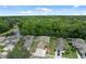 An exterior shot showing a suburban home's driveway, sidewalk, and surrounding landscaping on a sunny day at 12534 Chenwood Ave, Hudson, FL 34669