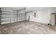 Spacious garage featuring an automatic door and ample room for parking and storage at 12534 Chenwood Ave, Hudson, FL 34669