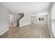 Spacious living room with wood floors, large windows, and plenty of natural light at 12534 Chenwood Ave, Hudson, FL 34669