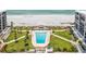 Aerial view showcasing the pool, community green space, and ocean access at 1400 Gulf Blvd # 701, Clearwater Beach, FL 33767