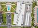Aerial view showcasing the pool, tiki huts, parking, and building layout at 1400 Gulf Blvd # 701, Clearwater Beach, FL 33767