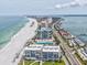 An aerial view of condo buildings, a pristine beach, and the city skyline at 1400 Gulf Blvd # 701, Clearwater Beach, FL 33767