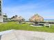 Condo common area featuring thatched tiki huts and tables near the beach at 1400 Gulf Blvd # 701, Clearwater Beach, FL 33767