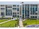 Beautiful condo building with a meticulously landscaped lawn and tropical plants at 1400 Gulf Blvd # 701, Clearwater Beach, FL 33767