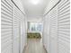 Hallway with ample closet storage leading to main bedroom at 1400 Gulf Blvd # 701, Clearwater Beach, FL 33767